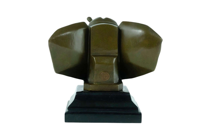Art Deco bronze elephant head sculpture with raised trunk and detailed features, mounted on a black marble base.