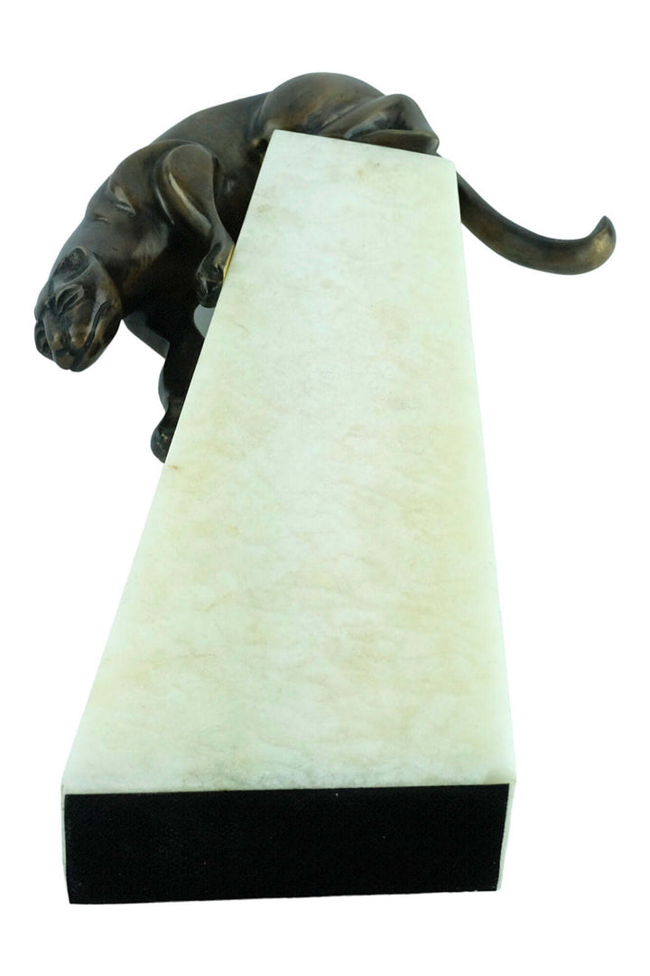 Art Deco bronze sculpture of a descending panther on an elegant onyx stone column, 27x17 cm, signed 'Jose Moriano'.