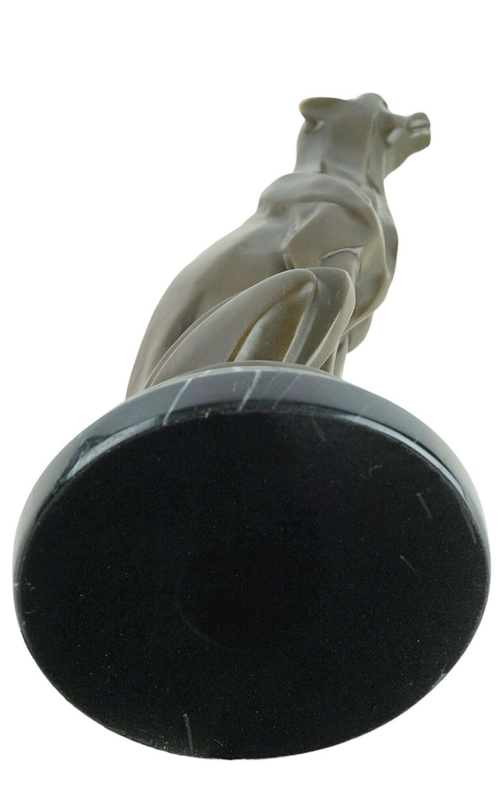 Bronze Art Deco sculpture of a sitting cheetah, sleek design on a marble base, signed by Michel Decoux.