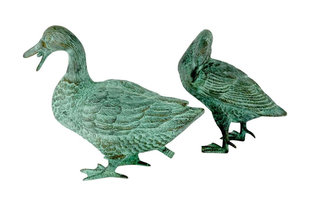 Pair of bronze duck sculptures, one featuring a fountain spray nozzle, ideal for garden decoration.