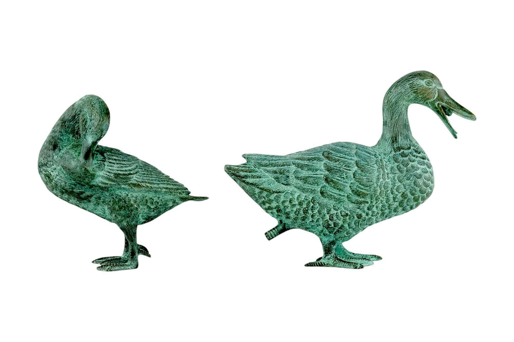 Pair of bronze duck sculptures for garden decor; one is a fountain and the other is preening its feathers.