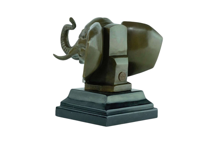 Bronze Art Deco elephant head sculpture on marble base, showcasing detailed features and warm patina.