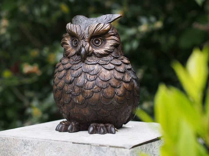 Bronze sculpture of a Eurasian eagle owl with detailed feathers and expressive eyes, ideal for display.