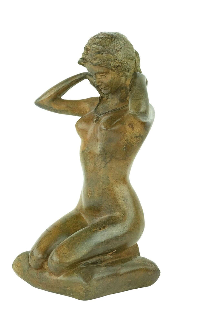 Bronze female nude sculpture by Pierre Chenet, depicting a woman kneeling and putting on a necklace, vintage art piece.