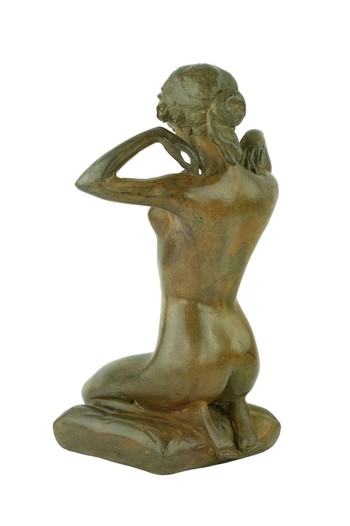 Bronze sculpture of a female nude kneeling while putting on a necklace, by Pierre Chenet, vintage art piece.