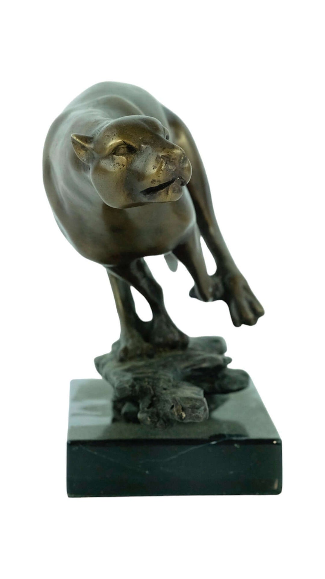 Bronze sculpture of a jaguar running on a marble base, capturing the spirit of wildlife art.