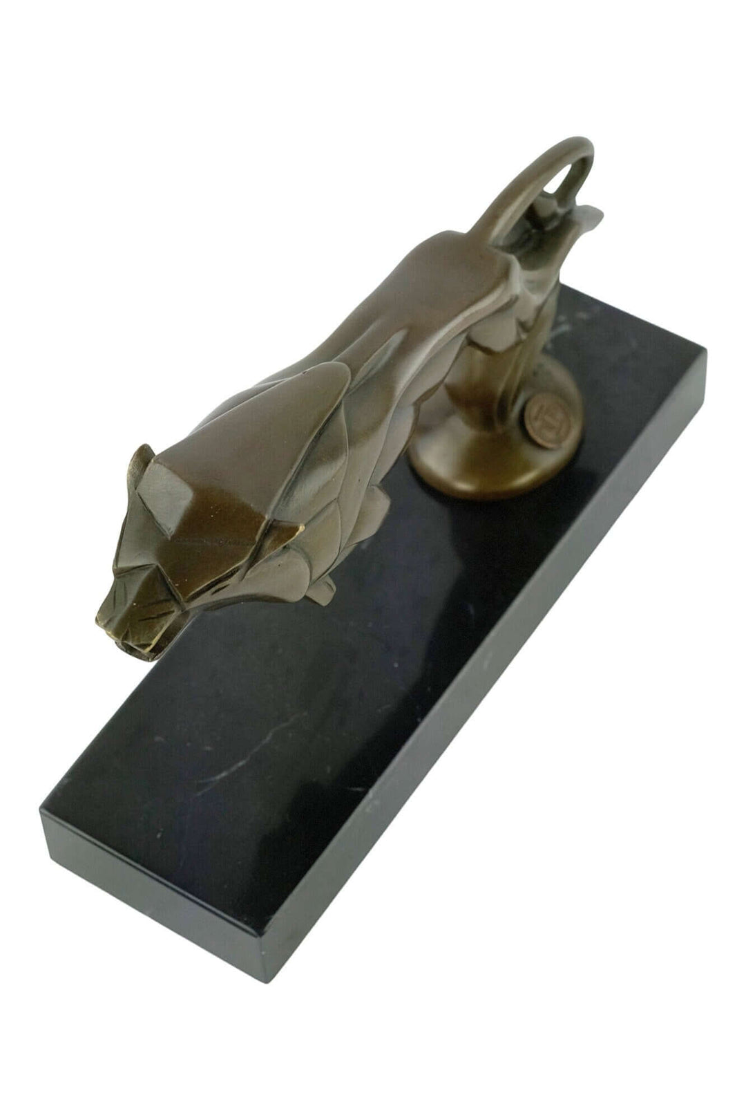 Bronze Art Deco sculpture of a leaping lion on a dark base, signed by C. Brau, measuring 16 x 22 cm.
