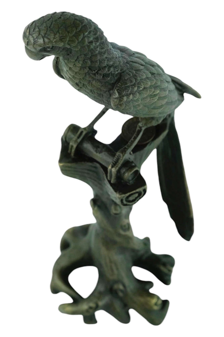 Bronze sculpture of a macaw on a tree trunk, detailed design, warm patina, 18 cm tall, signed by artist Nick.