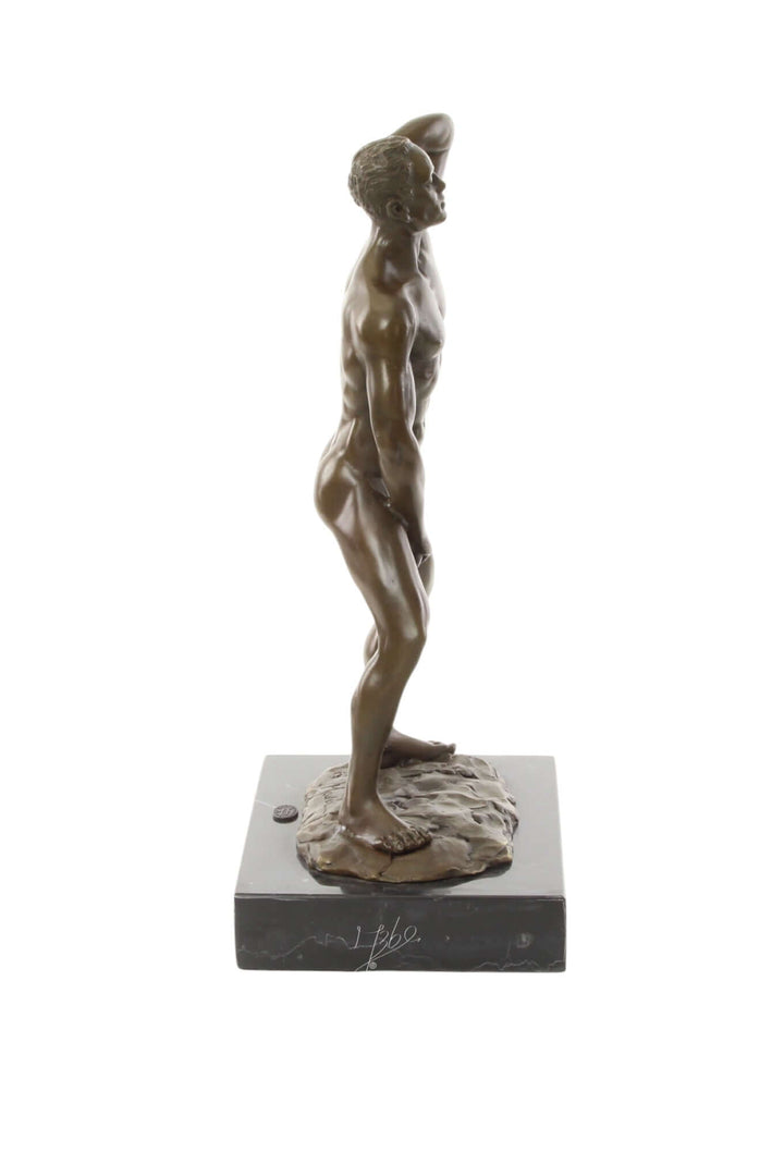 Bronze sculpture of a muscular male posing confidently, mounted on a marble base, 30cm tall.