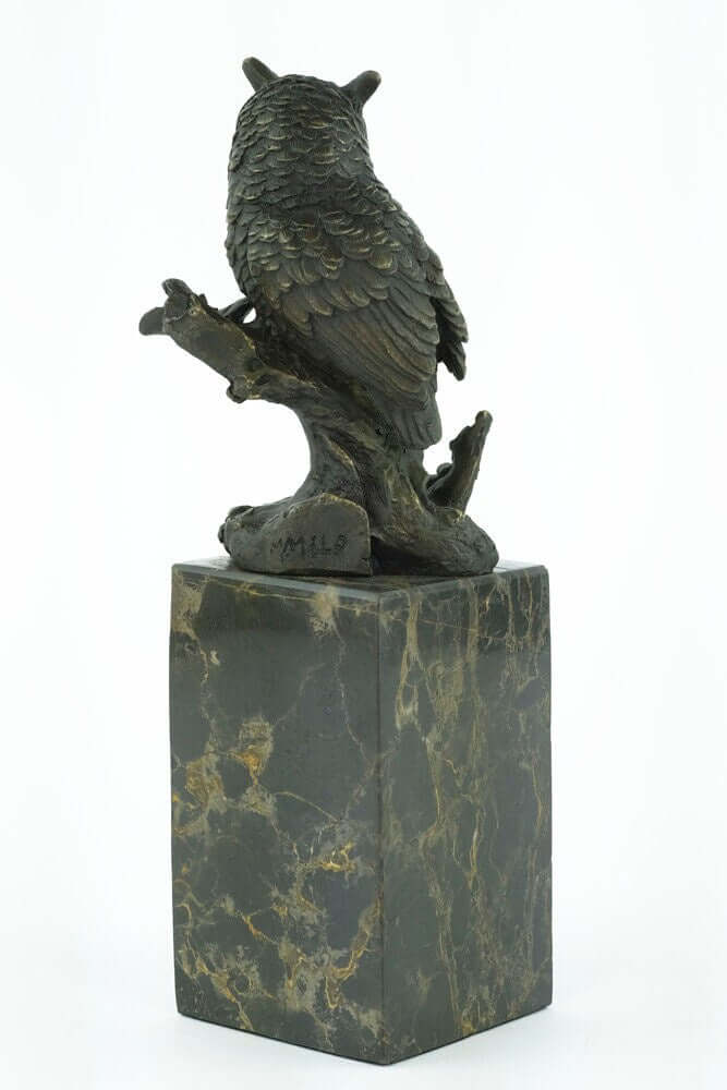 Bronze owl sculpture on a flamed marble base, designed with fine details, signed by Milo, 27 cm tall.
