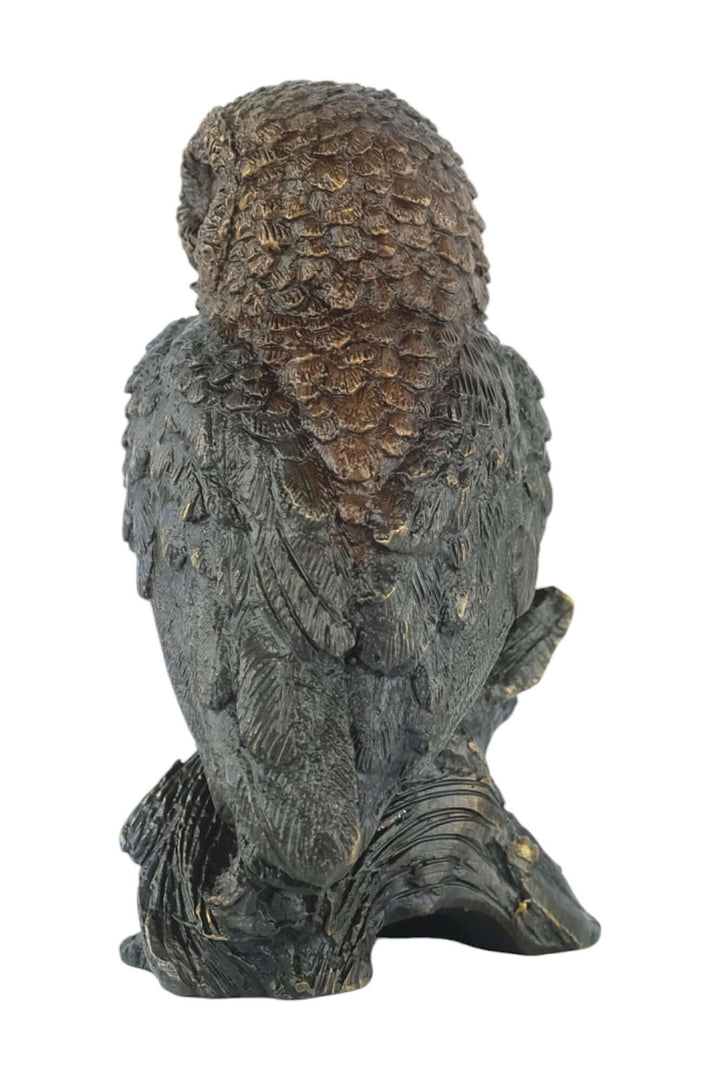 Bronze sculpture of a small owl perched on a tree trunk, showcasing fine details and a brown patina finish.
