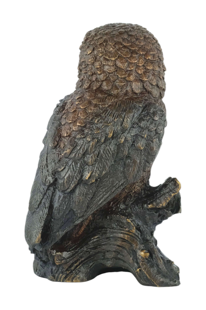 Bronze sculpture of a detailed small owl perched on a tree trunk, showcasing a brown patina finish.