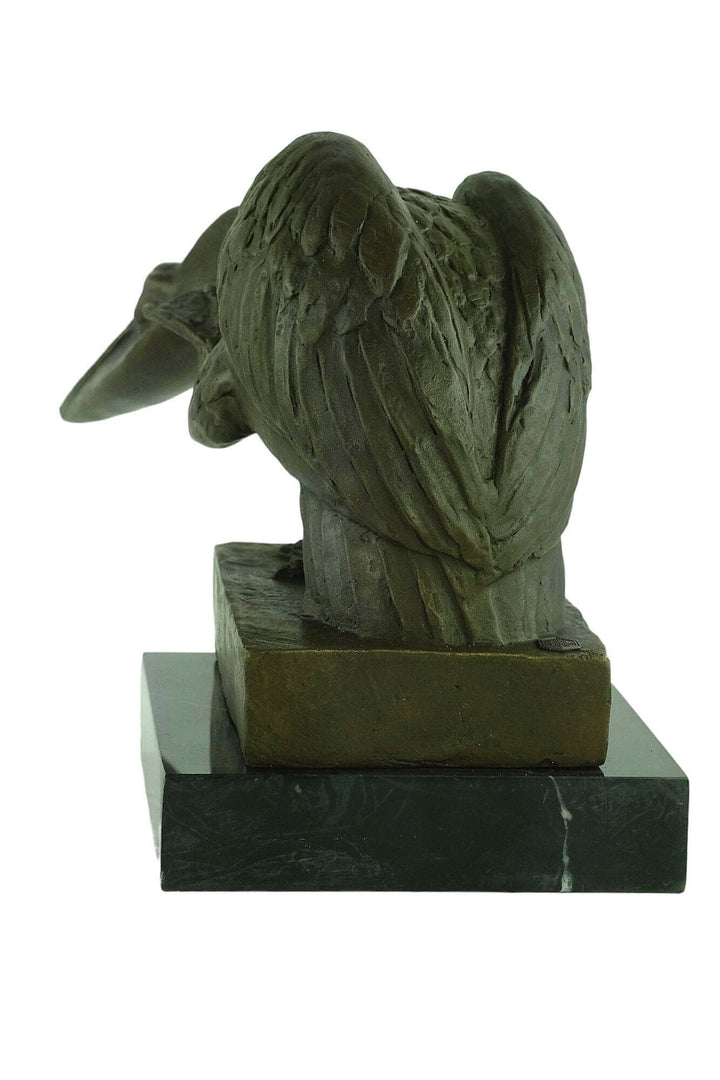 Bronze pelican sculpture on marble base, showcasing detailed feathers and natural pose, signed 'Milo', 24x40cm.