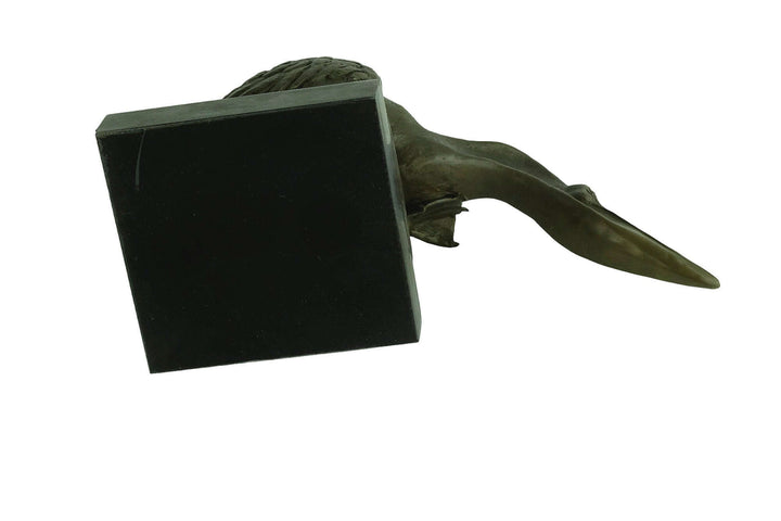 Bronze pelican sculpture seeking fish, with warm patina, mounted on a marble base, by Milo, 24 x 40 cm.