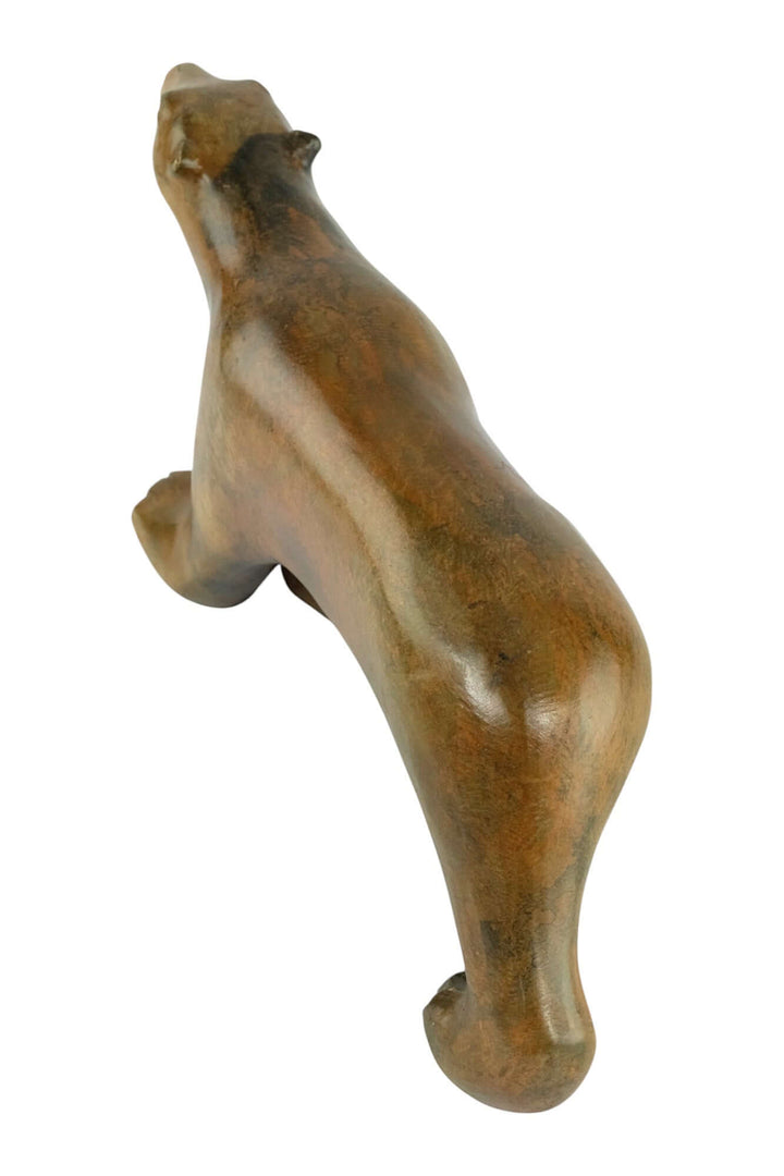 Bronze polar bear sculpture by Pierre Chenet, showcasing a walking bear with elegant patina, 17 x 34 cm.