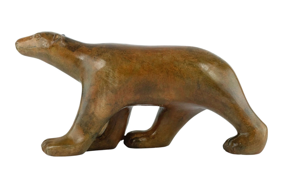 Bronze sculpture of a walking polar bear by Pierre Chenet, featuring authentic patina and signature detail.