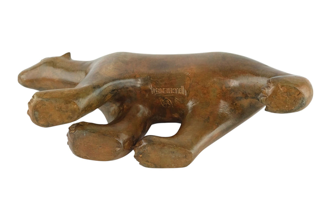 Bronze sculpture of a polar bear by Pierre Chenet, showcasing a detailed patina and artistic design.