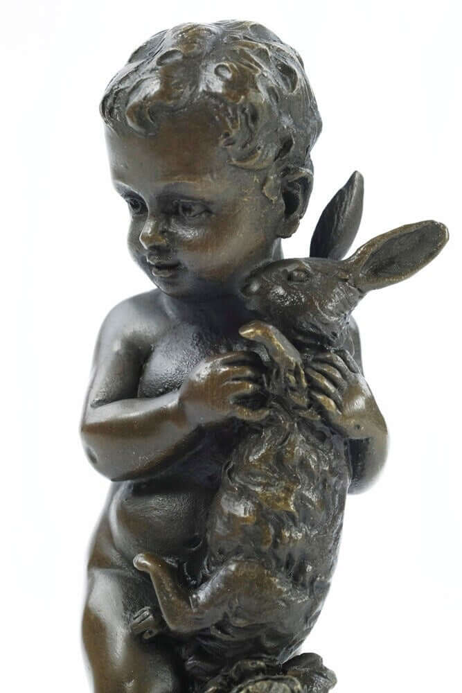 Bronze sculpture of a young boy holding a rabbit, quality craftsmanship, 15 cm tall, decorative art piece.