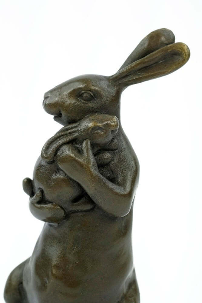 Bronze bunny statue holding a young bunny, detailed animal art sculpture for bunny lovers and home decoration.