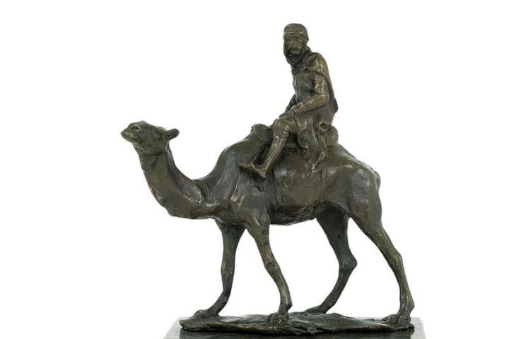 Bronze sculpture of a camel and Bedouin rider, signed by L. Carvin on a flamed marble base, perfect for decor.