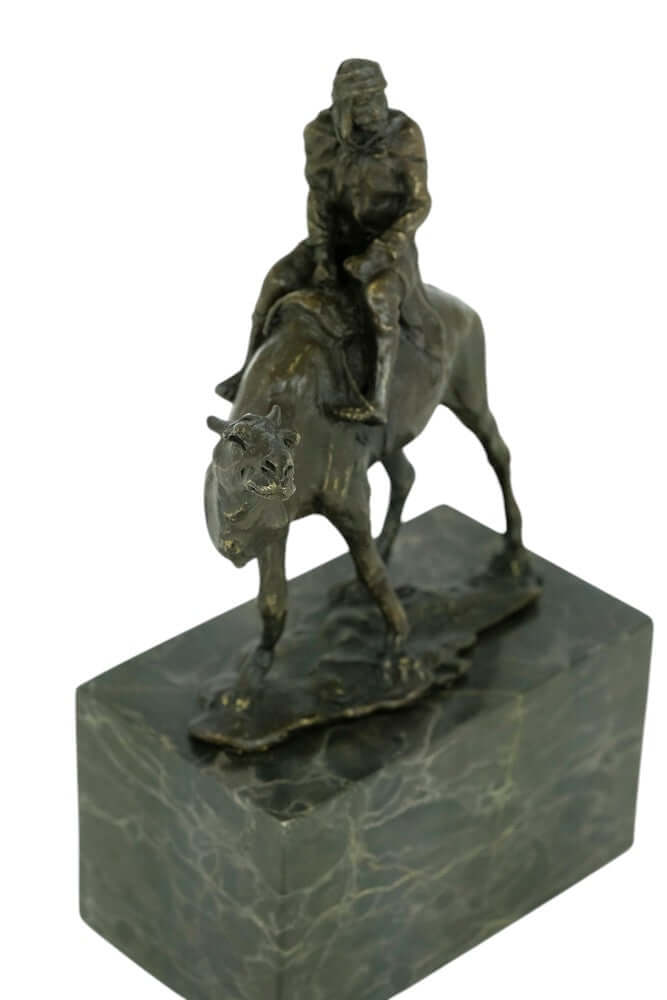 Bronze sculpture of a camel with Bedouin rider on flamed marble base, signed by L. Carvin, 22 x 14 cm.
