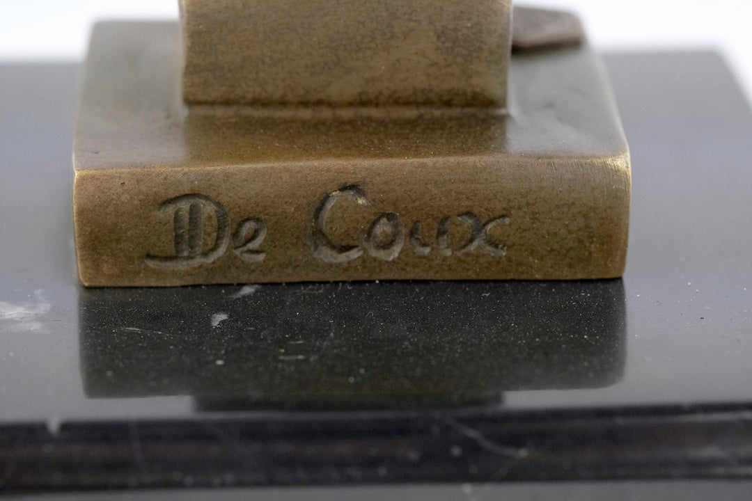 Signature of Michel Decoux on a bronze cat sculpture mounted on marble, highlighting fine craftsmanship.