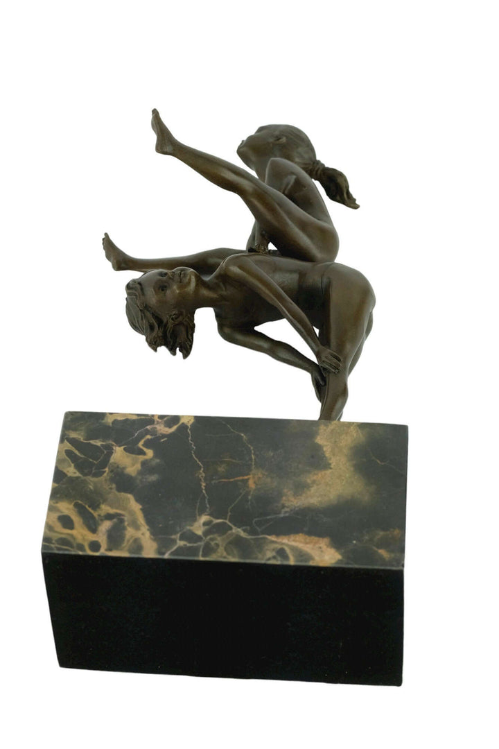 Bronze sculpture of children playing leapfrog on a flamed marble base, signed by Milo, 28 cm high.