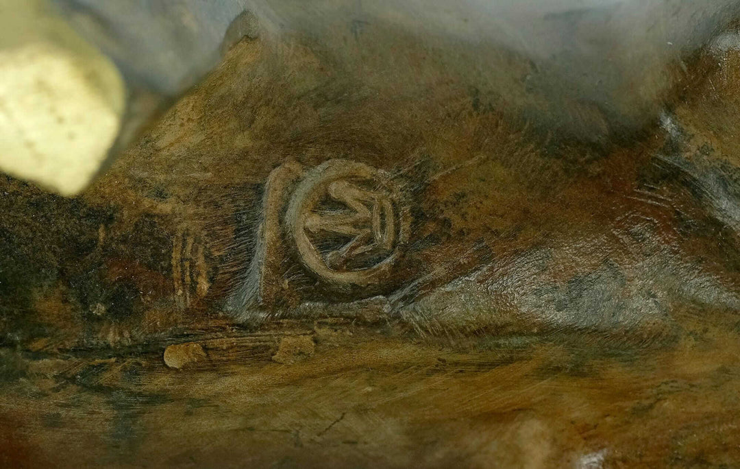 Close-up of the markings on a bronze sculpture by the Pierre Chenet Foundry, reflecting craftsmanship.