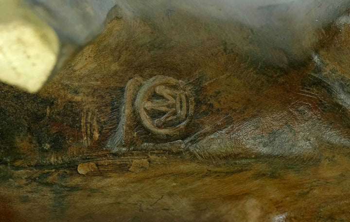 Close-up of the markings on a bronze sculpture by the Pierre Chenet Foundry, reflecting craftsmanship.