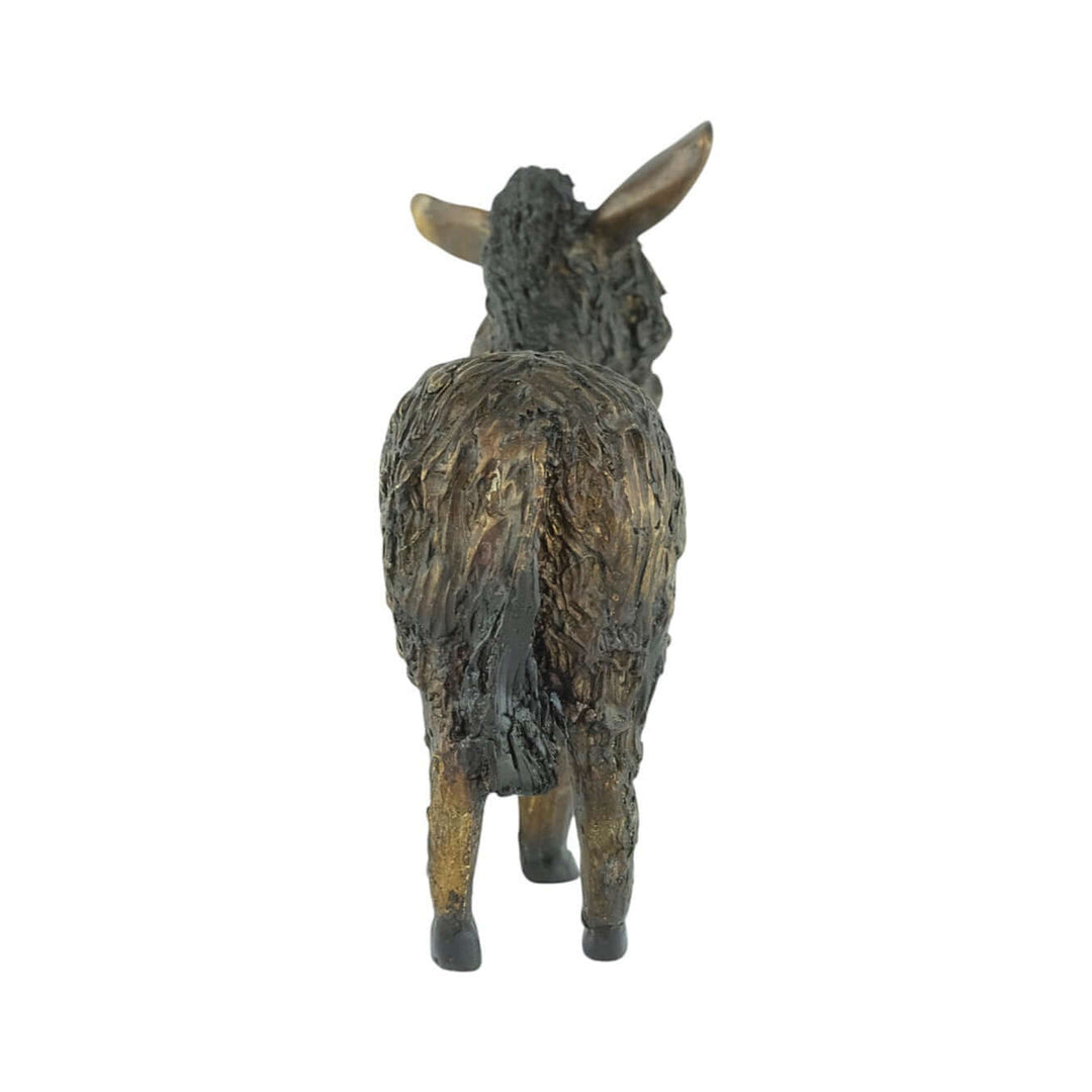 Bronze sculpture of a standing donkey with coat hair covering its eyes. Ideal for indoor or outdoor decor.
