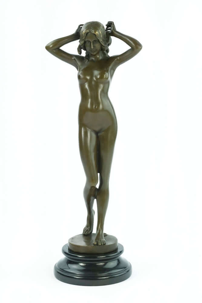 Bronze sculpture of a nude female playing with her hair, mounted on a round marble base, 38 cm tall.
