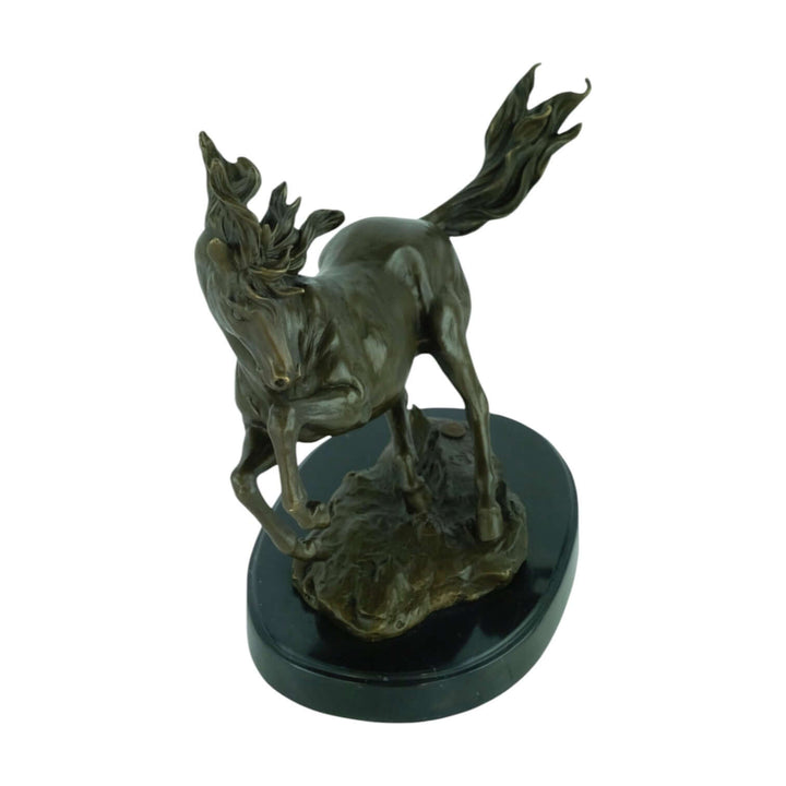 Detailed bronze sculpture of a galloping horse on a marble base, showcasing majestic design and craftmanship.