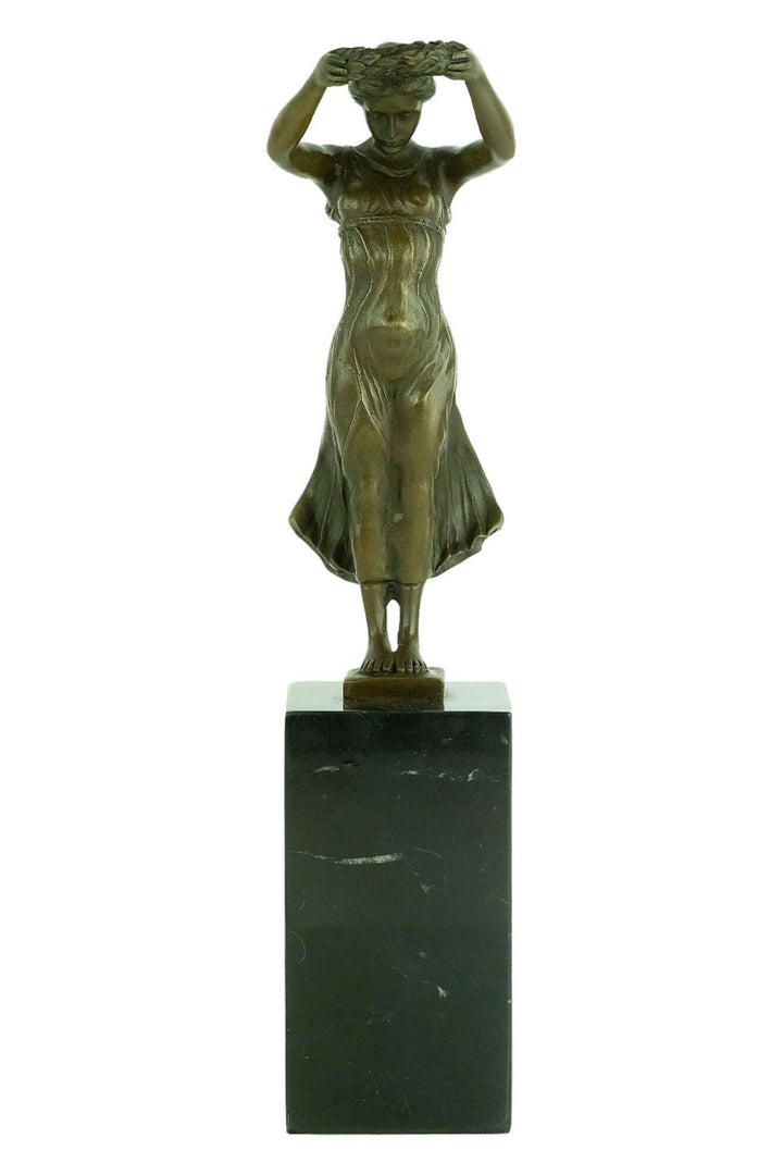 Bronze sculpture of Gelle Fra, the Golden Lady, by Claus Cito, on a marble base, commemorating WWI victims.