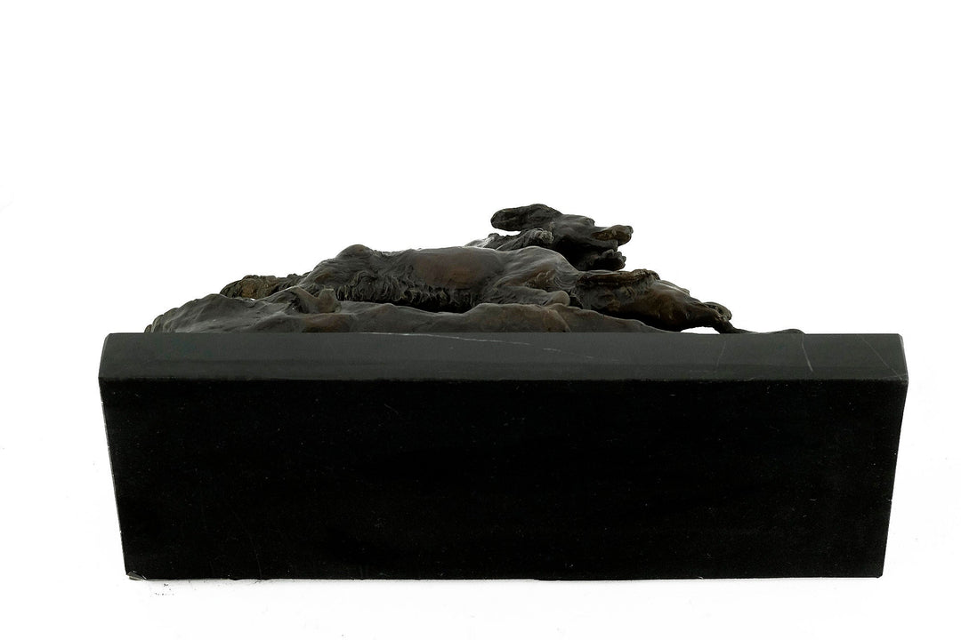 Bronze sculpture of hunting hounds chasing a duck, detailed artistry on dark marble, by Pierre-Jules Mène.