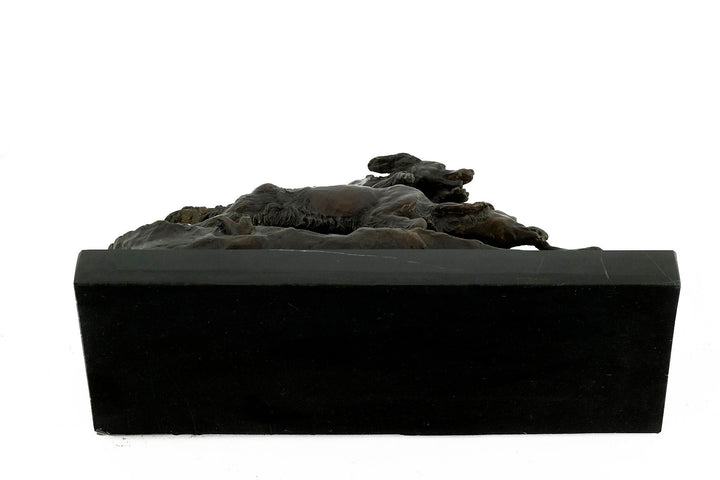 Bronze sculpture of hunting hounds chasing a duck, detailed artistry on dark marble, by Pierre-Jules Mène.
