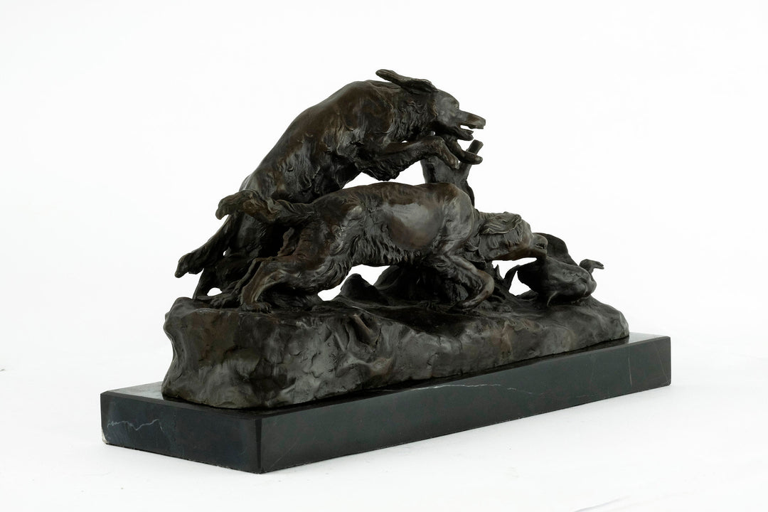 Bronze sculpture of hunting hounds chasing a duck, mounted on dark marble, by Pierre-Jules Mène.