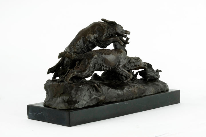 Bronze sculpture of hunting hounds chasing a duck, mounted on dark marble, by Pierre-Jules Mène.