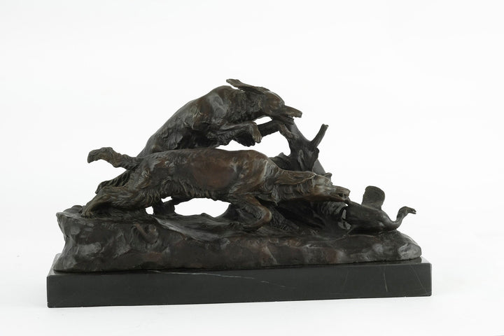 Bronze sculpture of hunting hounds chasing a duck, fine artistry by Pierre-Jules Mène, mounted on dark marble.