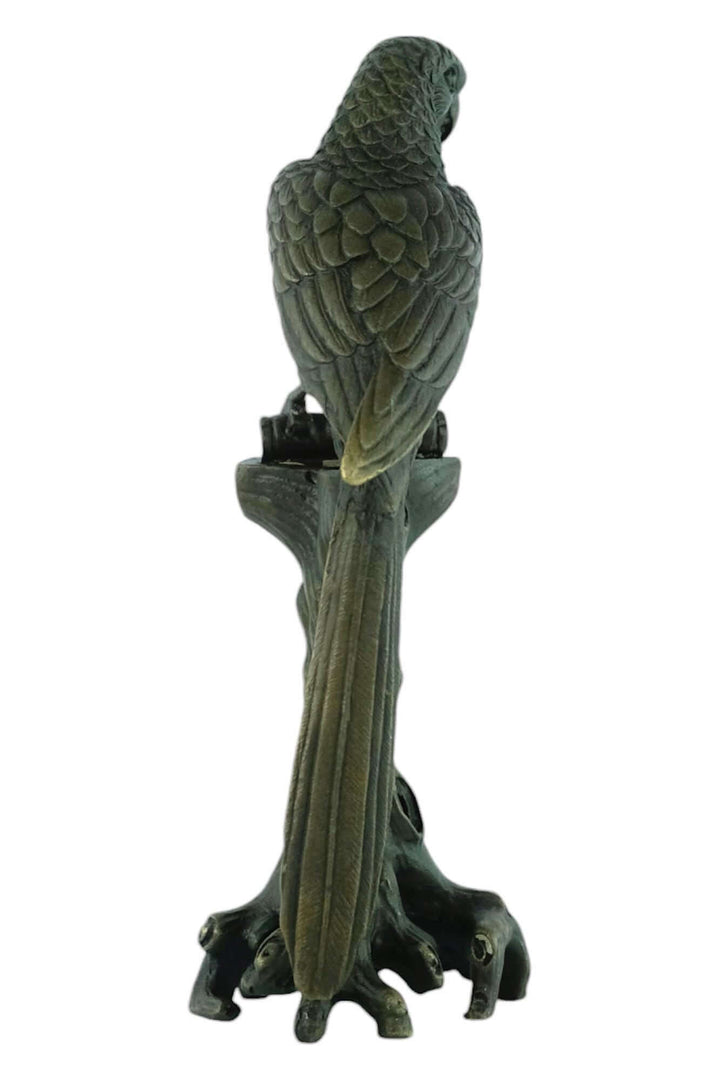 Bronze sculpture of a macaw on a tree trunk, detailed design and warm brown patina, 18 cm tall.