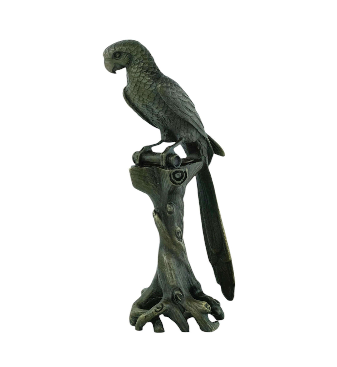 Detailed bronze macaw sculpture perched on a tree trunk, showcasing a rich patina and fine craftsmanship.