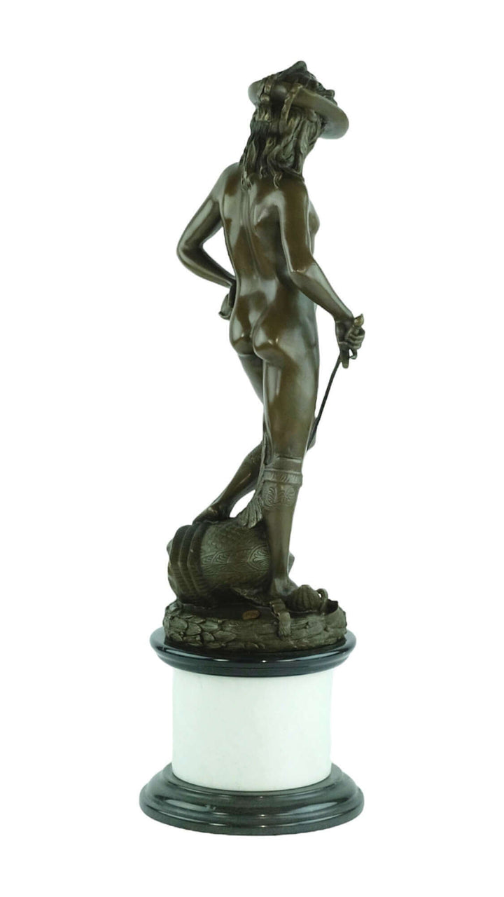Bronze sculpture of a nude figure with a sword, gracefully posed on a decorative base. Art piece in fine detail.
