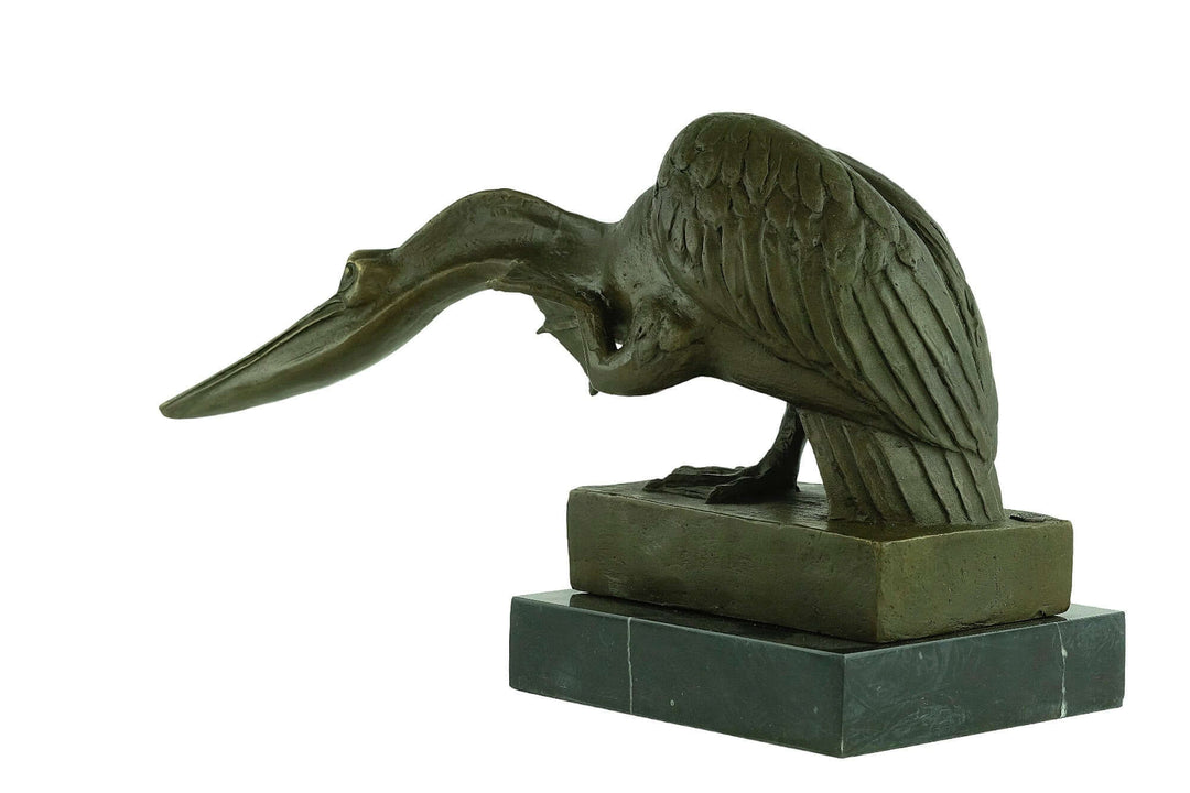 Bronze pelican sculpture seeking fish on marble base, signed by Milo. Dimensions: 24 x 40 cm, 9.8 kg.