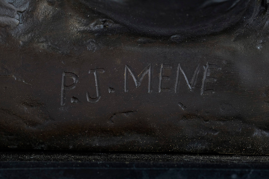 Close-up of signature 'P.J. Mene' on a bronze sculpture of hunting hounds chasing a duck.