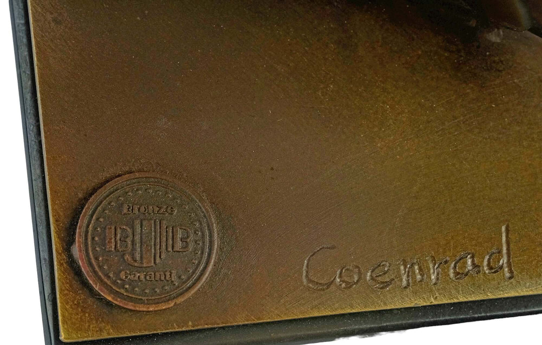 Close-up of the signature and bronze marking on a sculpture by Johan Coenraad Altorf, showcasing craftsmanship.