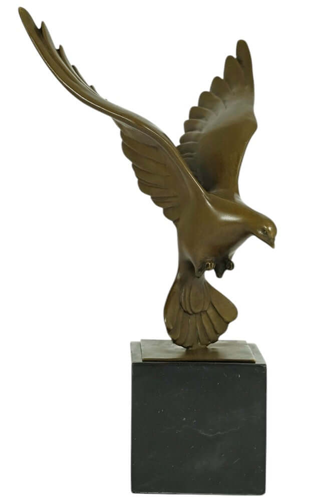 Bronze sculpture of a pigeon descending with wings spread, mounted on a marble base, 30 cm tall.