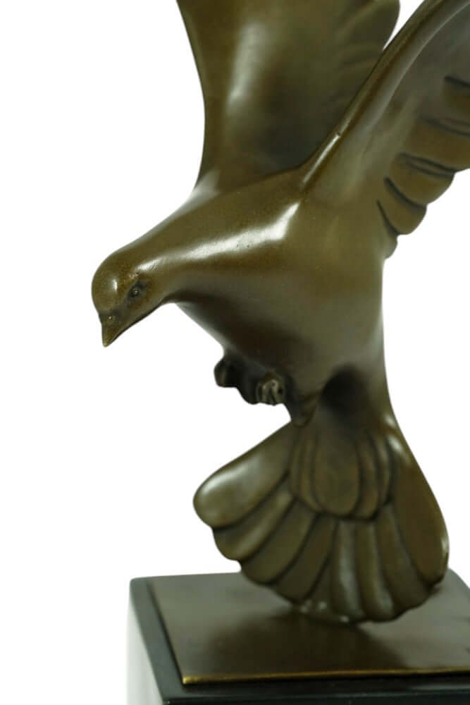 Bronze sculpture of a descending pigeon with wings spread, mounted on a marble base, Art Deco style by Altorf.