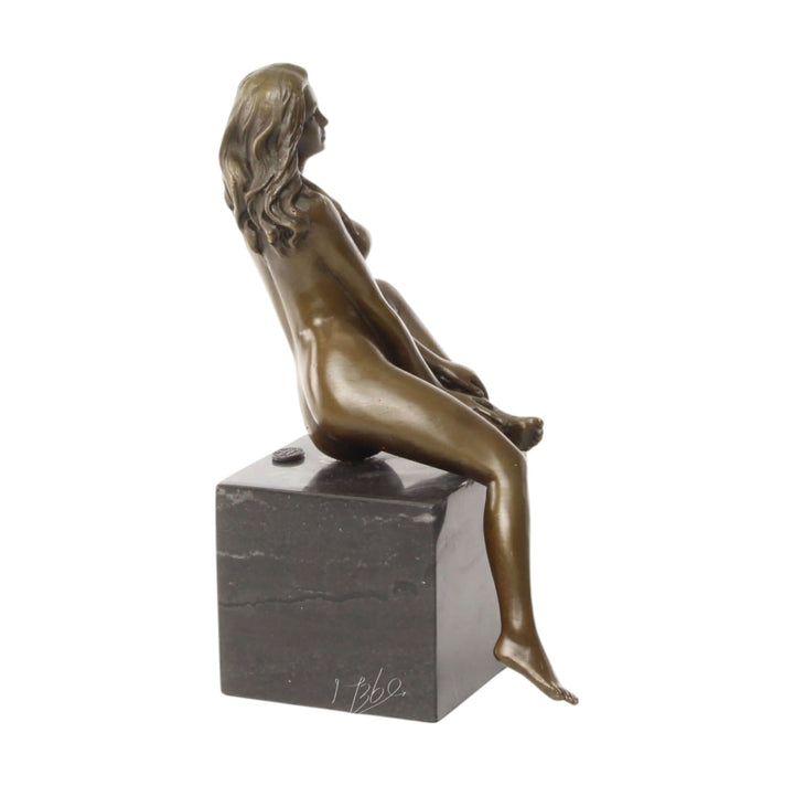 Bronze sculpture of a seated female nude with raised leg on a marble base, detailed and elegant design.