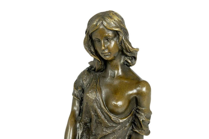 Bronze sculpture of a young female in a flimsy dress, showcasing fine detail and a light erotic display.