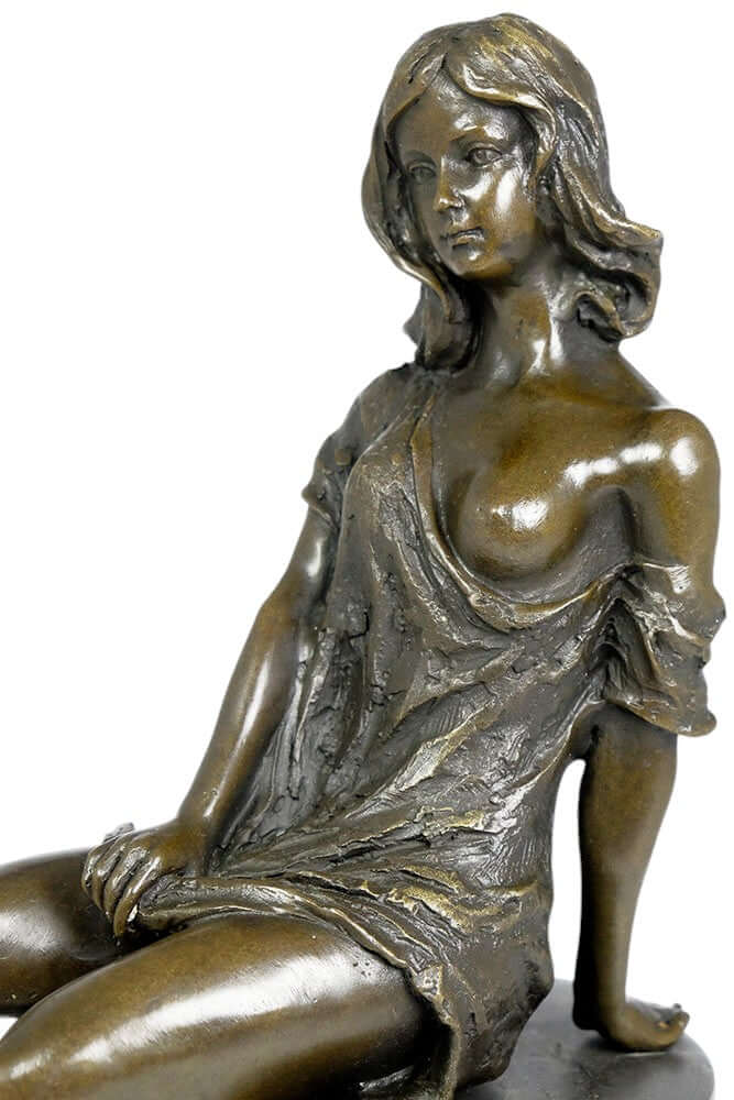 Bronze sculpture of a sitting young female in a flimsy dress, detailed and decorative, mounted on a marble base.