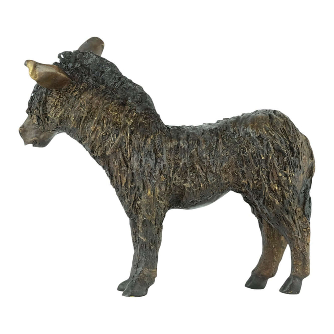 Bronze sculpture of a standing donkey with tousled coat; perfect decor for home or garden.